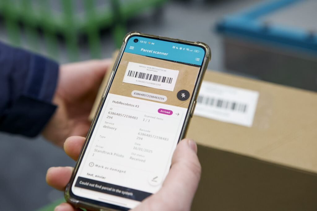 Package barcode being scanned by mobile device